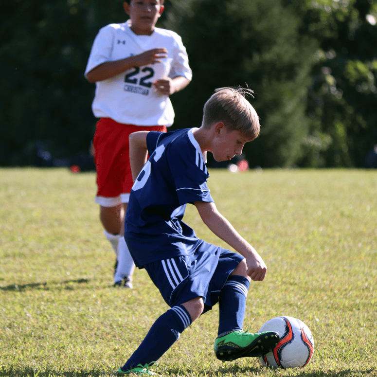 Junior Varsity boy's soccer - player using advanced footwork