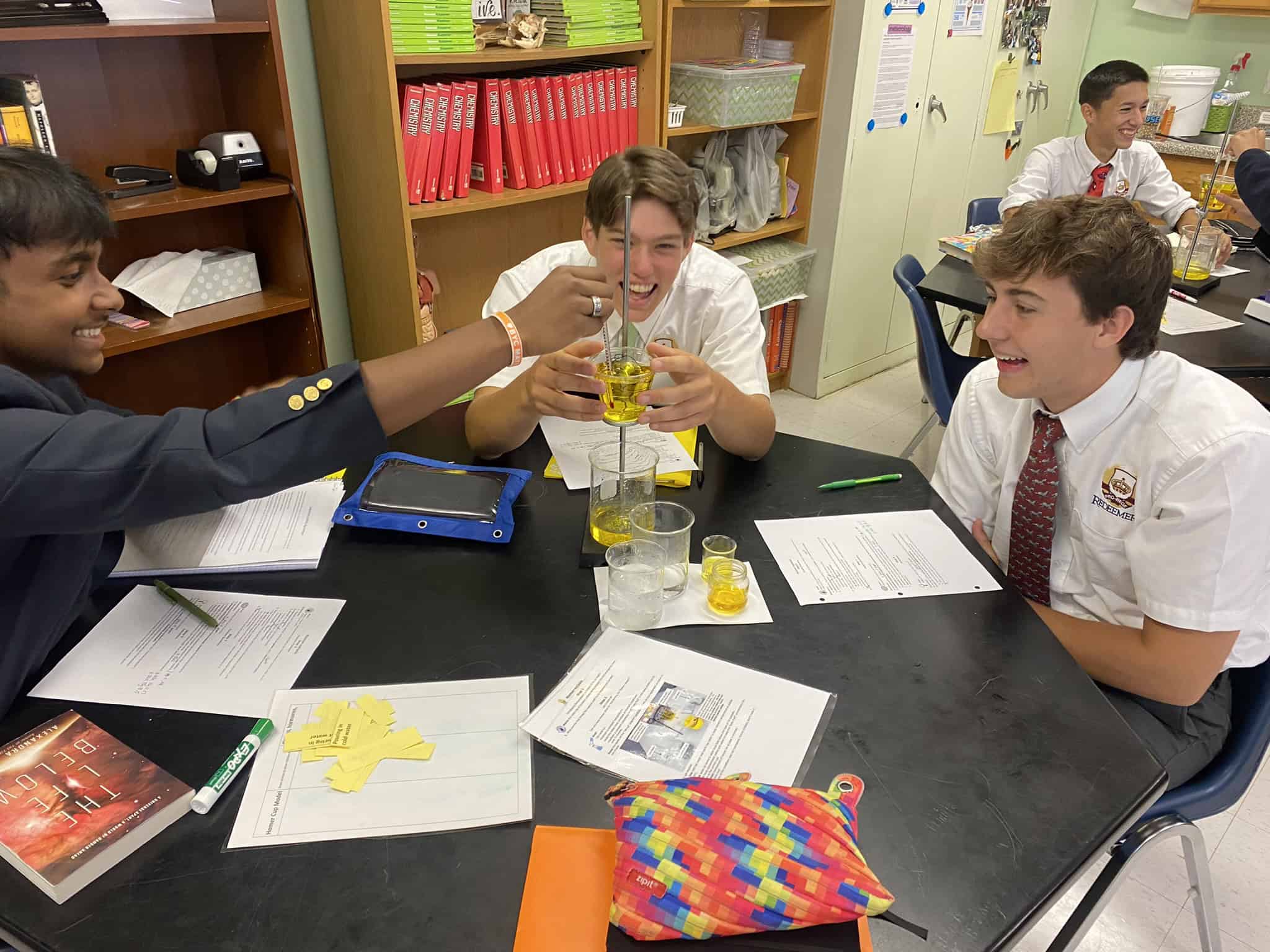 Redeemer Rhetoric School Boys participating in science experiments with beaker