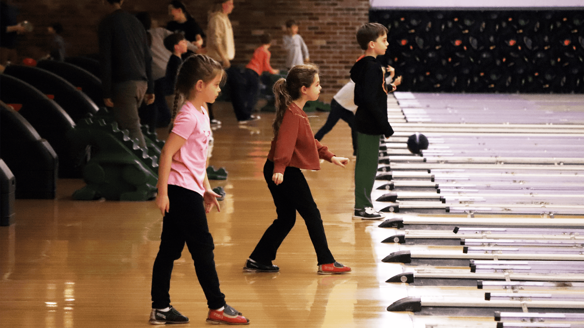 Grammar school students bowling as part of student life that private school in Harford County