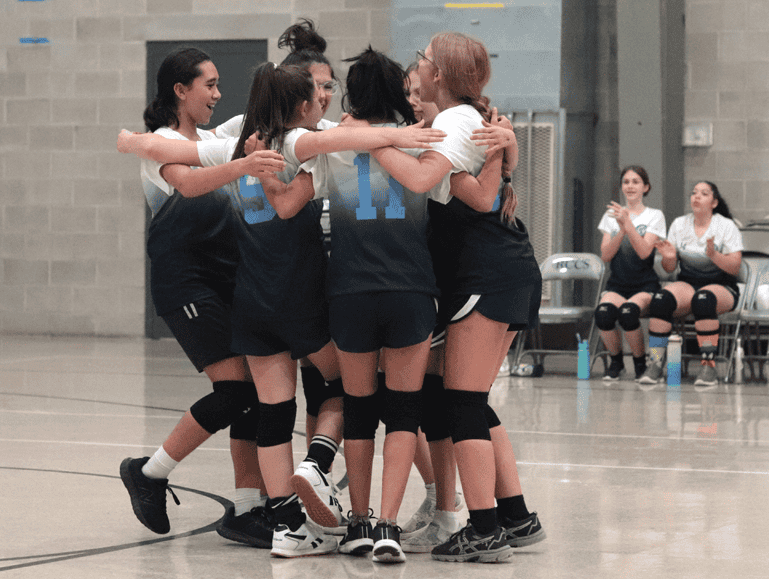 Redeemer girls varsity volleyball team huddling